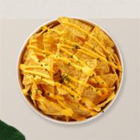 Queso Nachos · (Vegetarian) Salted tortilla chips doused in melted nacho cheese.