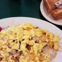#1 Johnny'S Breakfast Special · Two eggs with your choice of ham, bacon, or sausage, served with hash browns or grits, and t...