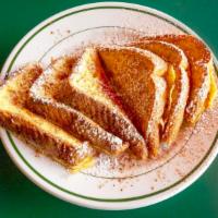 Texas French Toast · Topped with powdered sugar and cinnamon.
