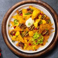 Nacho Ordinary Cheesy · (Vegetarian) Salted tortilla chips doused in melted nacho cheese.