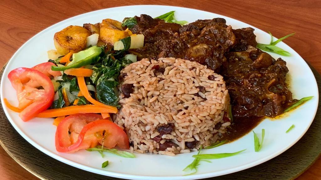  Sm. Ox Tail · Served with red beans and rice,cabbage and plantains