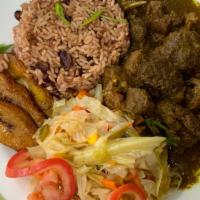 Curry Goat  · Jamaican style Curry Goat 
Served with Red Beans and Rice, cabbage and Plantains