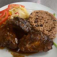 Brown Stew · Brown Stew Chicken served with Red Beans and Rice, Cabbage and Plantains
