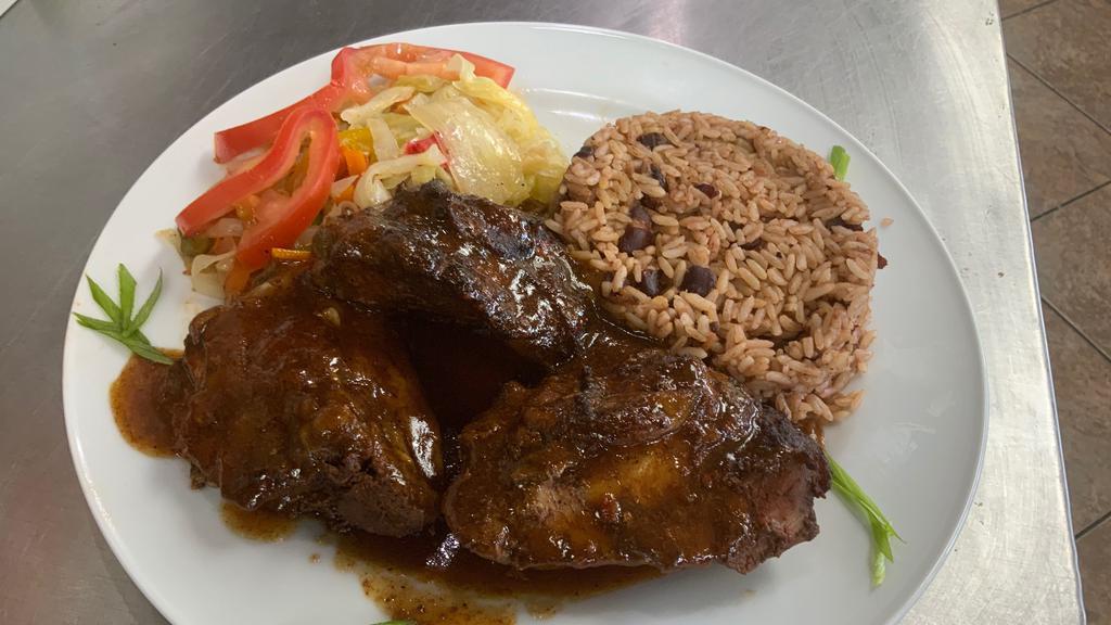 Brown Stew · Brown Stew Chicken served with Red Beans and Rice, Cabbage and Plantains