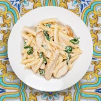Classic Chicken Alfredo · Classic chicken alfredo served with salad and garlic bread.