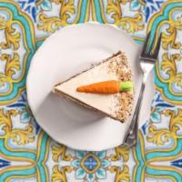 Carrot Cake · Modern carrot cake with white cream cheese frosting with pecan nuts and premium almonds.