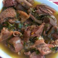 Goat Pepper Soup · Includes small White Rice