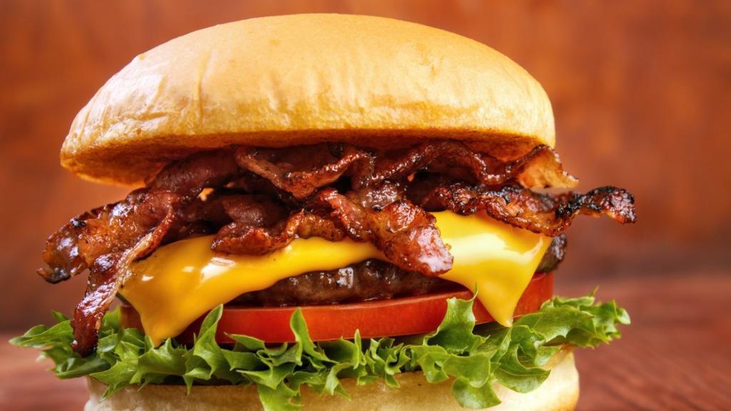 Yankee Bacon Cheeseburger · 1/2 pound burger, American cheese, bacon, lettuce, tomato, uptown sauce on a brioche bun.