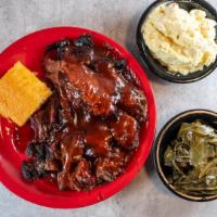 Bbq Beef Brisket · Choice of two sides and served with cornbread and Q's BBQ sauce.