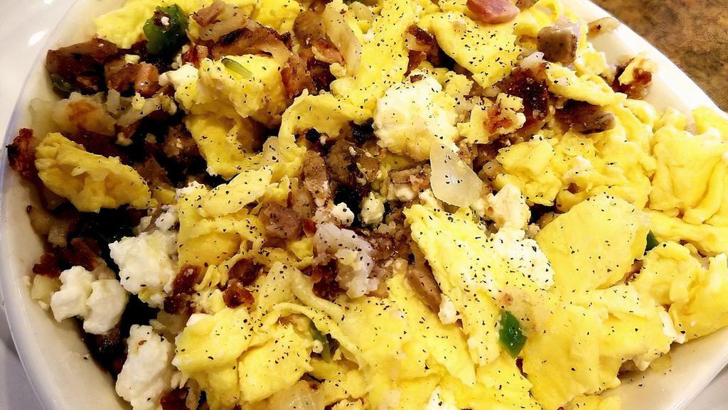 Gyro Skillet · Made with sautéed green peppers, fresh mushrooms, yellow onions, gyro meat, layered atop potatoes with three eggs any style and feta cheese, and toast.