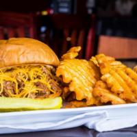 Sassy Sow · Our shredded pork tossed in Jim beam bourbon bbq sauce, then topped with cheddar cheese. Ser...