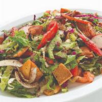 Fattoush · Lettuce, tomato, cucumber, peppers, radishes, olive oil, and lemon juice. Topped with pita b...