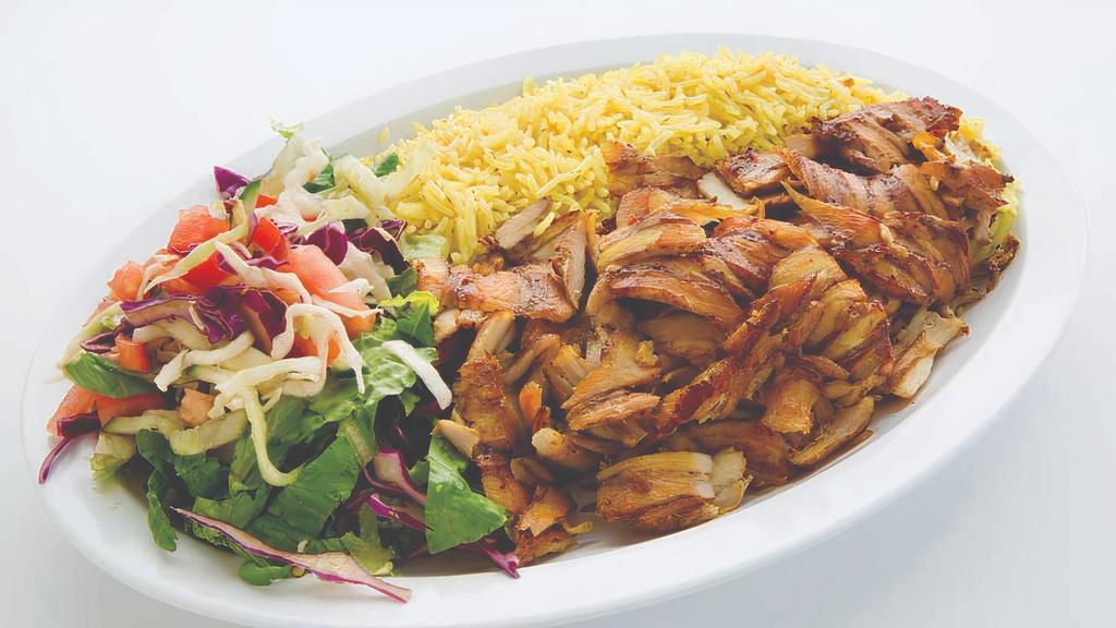 Chicken Shawarma · Marinated chicken cooked on an upright split then thinly sliced. Served with salad and rice.