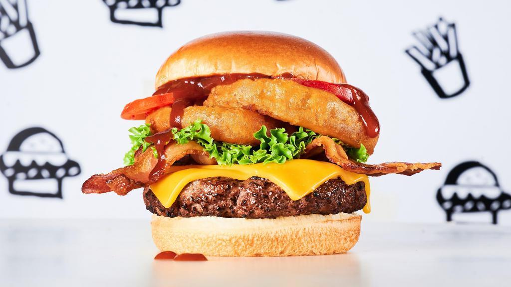 Butch'S Wild Bbq Burger · Burger, BBQ sauce, cheddar cheese, bacon, onion rings, lettuce & tomato