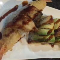 Dragon · Shrimp tempura, cucumber, topped with avocado eel and eel sauce.
