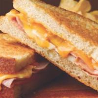 Grilled Ham & Cheese · American  cheese and ham of the bone.