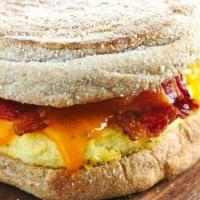 Breakfast Sandwich · Two eggs, American cheese, choice of breakfast meat.