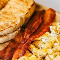 Good Morning Breakfast · 2 eggs, 3 pieces of bacon, and sourdough toast, served with jelly