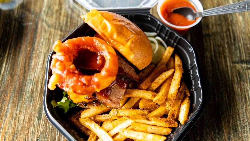 Contractor · Mayo, lettuce, tomato, smoked brisket, bacon, cheddar, beer-battered onion ring, Memphis bbq sauce served with sweet and smoky fries.