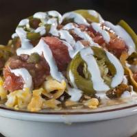 Smoke Pit Chili (Loaded) · Loaded with salsa, cheddar jack cheese, sour cream, and pickled jalapeños.