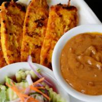 Chicken Sate (4 Sticks) · Marinated and char-broiled chicken breast served on sticks with peanut sauce and cucumber sa...