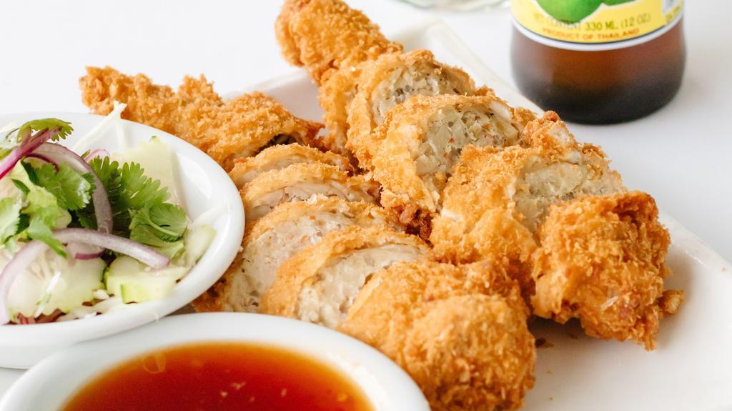 Angel Wings (2 Wings) · De-boned chicken wings, stuffed with ground chicken, bean thread and water chestnuts deep fried with special sauce.