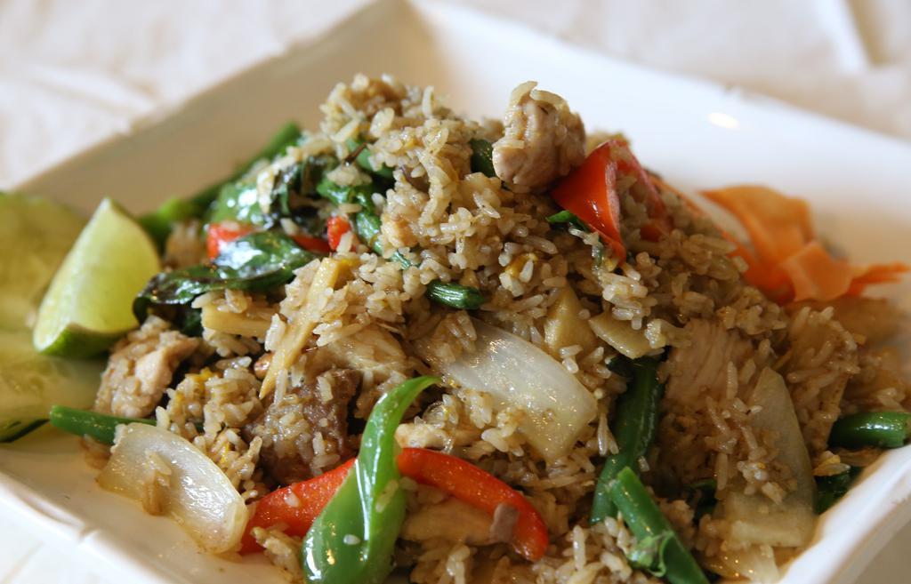 Green Curry Fried Rice (Spicy) · Selected meat, seafood or vegetables and tofu, green curry spices, basils, chili, onions, bell, bamboo slices, green beans, and egg.