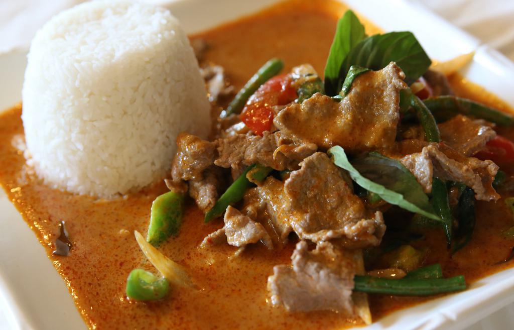 Spicy Stir-Fried · Selected meat or vegetable/tofu stir-fried with onions, green beans, bell peppers, basil leaves, red curry sauce and Thai spices.