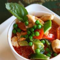 Panang Curry (Spicy) · Like red curry, Panang is made with coconut milk, basil, peas, bell peppers, and lime leaves.
