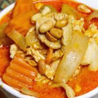 Massaman Curry (Spicy) · Chicken or tofu simmered in coconut milk with onions, peanuts, potatoes, and sweet potatoes.