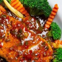 Four Seasons Salmon (Spicy) · Grilled salmon with onions, garlic, peppers in our house sweet & sour sauce served with stea...