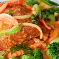 Chu-Chee Salmon (Spicy) · Grilled salmon with coconut milk, peppers, onions, red curry paste served with broccoli,  zu...