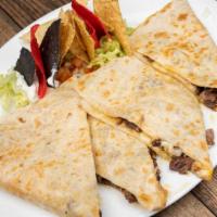 Cheese Quesadillas With Steak · Grilled flour tortilla filled with melted cheese, garnished with guacamole and sour cream.