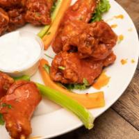 Buffalo Wings · Our jumbo chicken wings served breaded naked or boneless and tossed in anyone of our delicio...