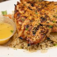 Greek Chicken Breast · Tender breast of chicken char-grilled and seasoned our olive oil and lemon herb sauce. Serve...