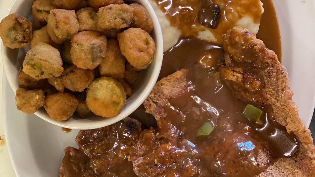Pork Chop Dinner  · 2 pork chop Served, two sides of your choice add brown gravy & bread optional