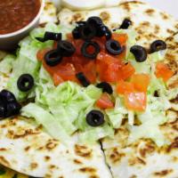 Quesadillas · Queso blend, bean, beef or chicken, topped with lettuce, tomato and black olive, served with...