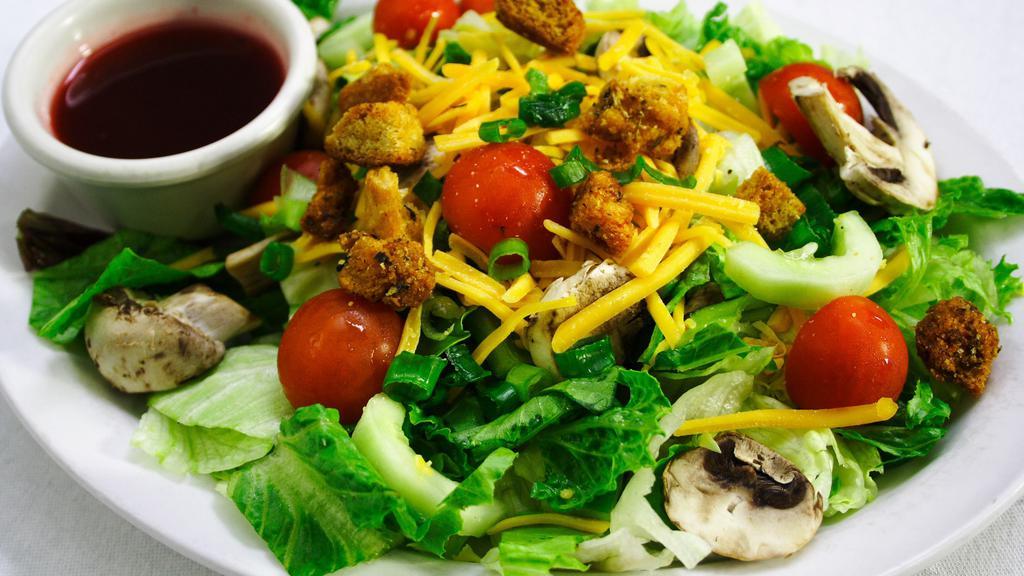 Dinner Salad · Mixed greens, tomato, cheddar cheese, mushroom, green pepper, cucumber, green onion and croutons.
