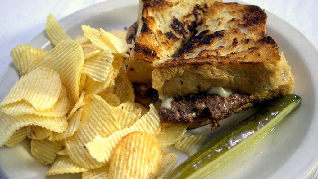 Patty Melt  · Burger patty between grilled homemade wheat with grilled onion and melted cheese.