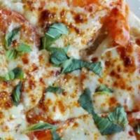 Gluten Free Margherita Pizza · Mozzarella / Tomatoes / Basil/  Extra virgin olive oil / Gluten free crust