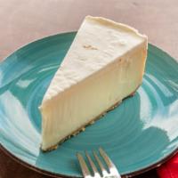 New York Supreme Cheesecake · Gloriously smooth, impossibly creamy new york style cheesecake rests in a graham cracker cru...