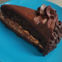 Ultimate Chocolate Cake · Chocolate cake, velvety chocolate mousse between layers, chocolate cookie crust, chocolate g...