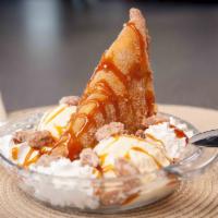 Salted Caramel Deep Fried Apple Pie · Rolled in cinnamon sugar, drizzled with salted caramel on top of vanilla ice cream with cand...