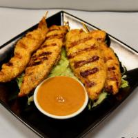 Satay (4) · Chicken strips on skewers served with peanut and sauce.