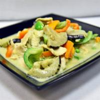 Green Curry One Size · Spicy. Green curry in coconut milk with peas, bell pepper, and eggplant.