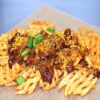 Chili And Cheese Waffle Fries · Waffle Fries with our Homemade Chili topped with Shredded Cheese and Green Onion.  ADD any o...