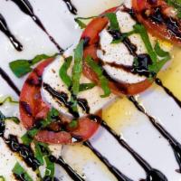 Caprese · Fresh mozzarella cheese, sliced Roma tomatoes, extra virgin olive oil, and basil, drizzled w...