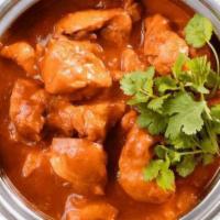 Chicken Vindaloo · Chicken cooked with potatoes in tangy curry sauce.
