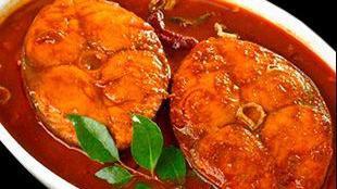 Fish Bhuna · Cooked with tomatoes, bell pepper, and thick sauce.
