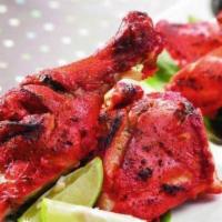 Chicken Tandoori · Fresh chicken with bone marinated with mild spices, herbs, then baked in a clay oven.
